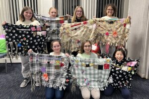 Local Girl Scouts bring comfort to nursing home residents, celebrate the end of an era